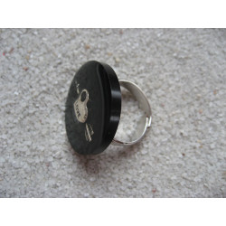 Fancy ring, silver arrow heart, on black resin background