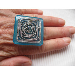Very large square ring, Silver graphic print, on blue resin background