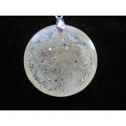 Fancy pendant, silver microbeads, on a pearly white resin background