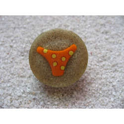 Summer ring, orange bikini bottom, on resin sand background