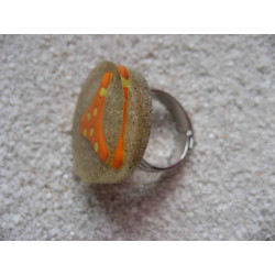 Summer ring, orange bikini bottom, on resin sand background