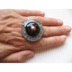 Large graphic ring, silver pearl, on black and silver background in resin