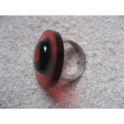 Fancy ring, red pearl, on black and red background in resin