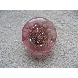 Fancy ring, silver microbeads, on mauve resin background