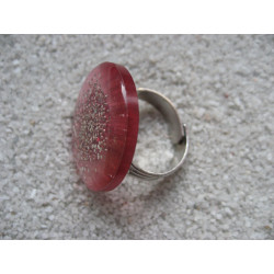 Fancy ring, silver microbeads, on mauve resin background