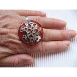 Large ring, silver stamp with holes, on a red resin