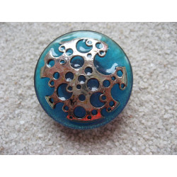 Large adjustable ring, silver print with holes, on turquoise resin background
