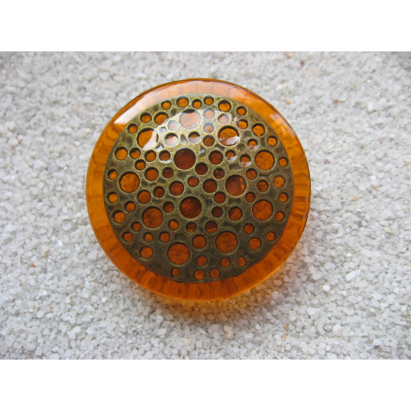 Very large ring, bronze print, orange resin background