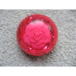 Large cabochon ring, pink flower, on fuchsia resin background