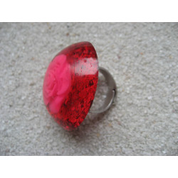 Large cabochon ring, pink flower, on fuchsia resin background