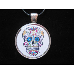 Fancy pendant, Mexican head on a white background, set in resin