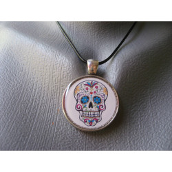 Fancy pendant, Mexican head on a white background, set in resin
