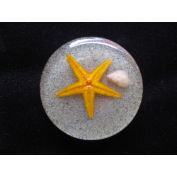 Large summer ring, orange starfish, on resin sand background