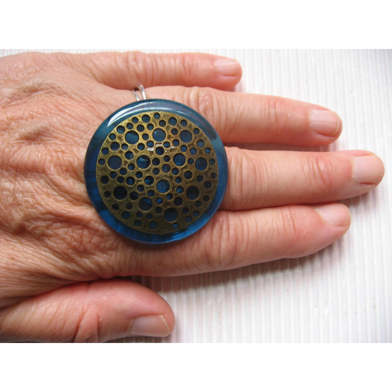 Very large ring, Bronze stamp with holes, on a blue resin background