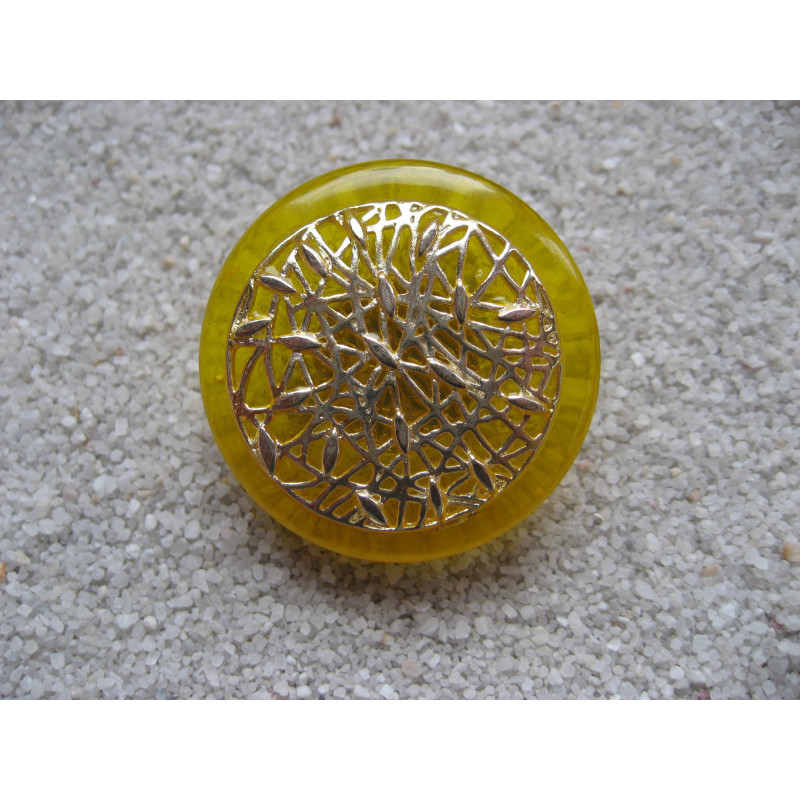 Large graphic ring, Silver print, on a yellow resin background