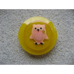 Very large pink owl ring in fimo on a yellow resin background