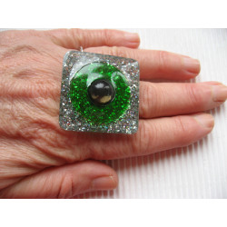 Very large square ring with black pearl on a green and silver background in resin