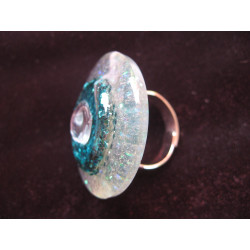 Large ring, white pearl, on a glittery blue background and pearly white resin