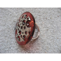 Large ring, silver stamp with holes, on a red resin