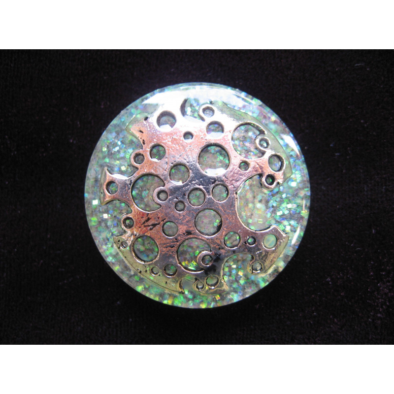 Large ring, pierced silver print, on pearl white resin