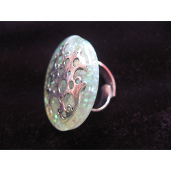 Large ring, pierced silver print, on pearl white resin