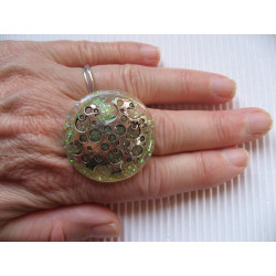 Large ring, pierced silver print, on pearl white resin
