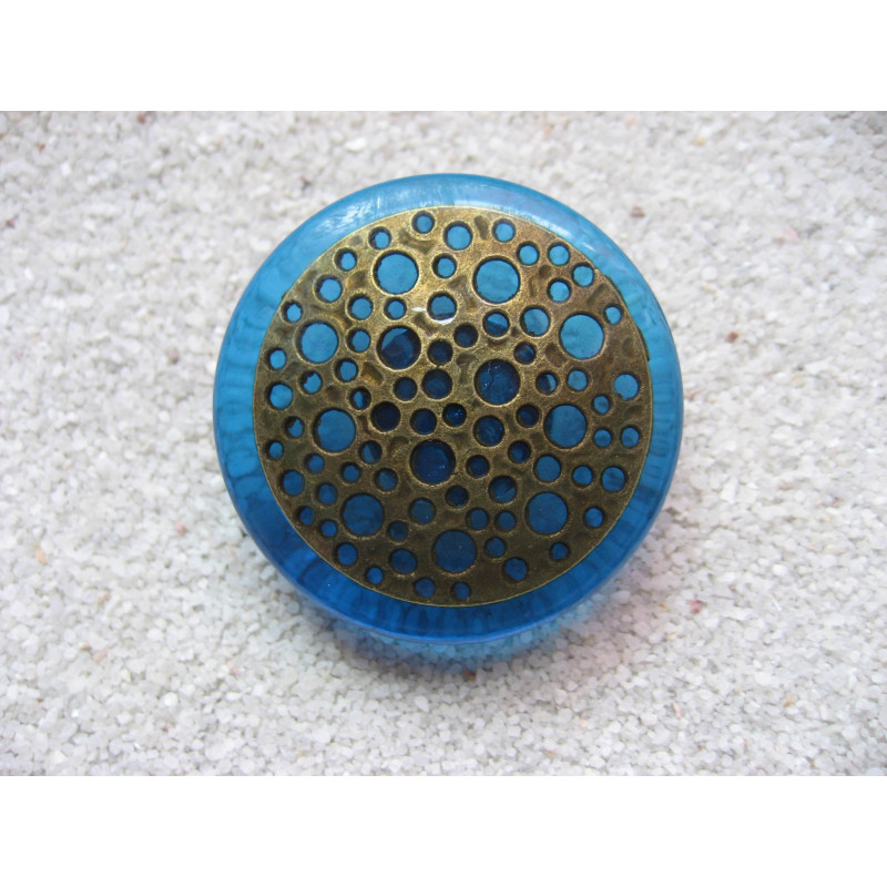 Very large ring, Bronze stamp with holes, on a blue resin background